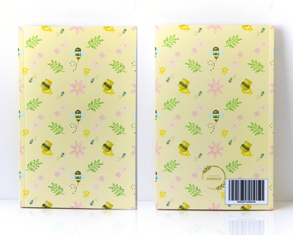 Yellow Pastel Notebook front and back with a cover featuring watercolour bees, leaves, pink flowers, and honey pots