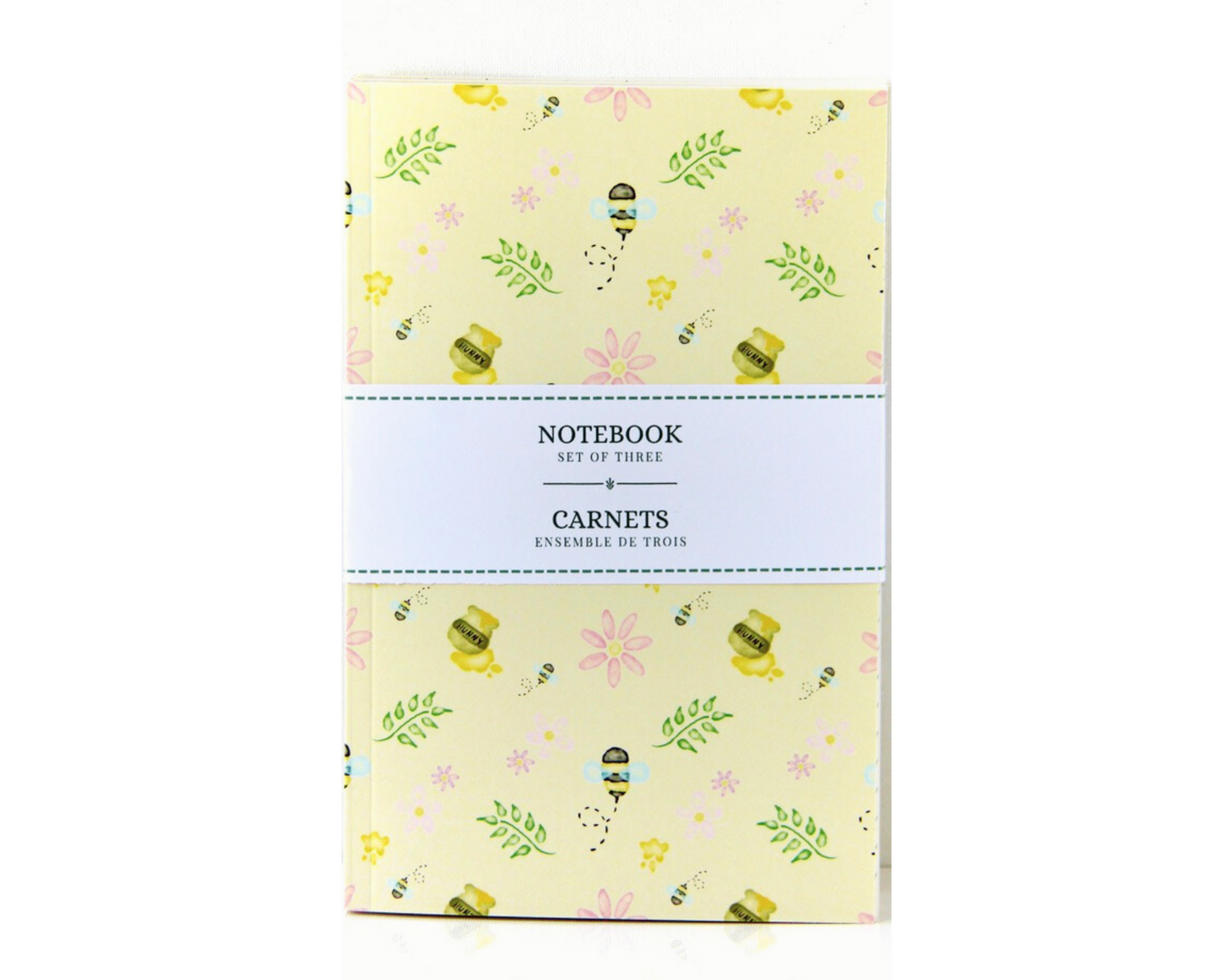 Yellow Pastel Notebook Set of Three with covers featuring watercolour bees, leaves, pink flowers, and honey pots